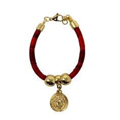 Meet our candy-look bracelet with a gold pleated San Benito charm. Wear it by itself or many together, they look fantastic. 8 inches long. Clay Bracelet, Camera Straps, Beautiful Handbags, Blue Bracelet, Ethnic Wear, Handmade Accessories, Jewelry Bags, Handmade Shop, Beautiful Bracelet