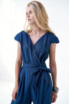 "Stunning, elegant linen jumpsuit with deep V neckline is a something impressive and practical, suitable for your everyday life. This piece of clothing is very feminine, very comfortable and absolutely beautiful. Blue summer overalls will surely make your day: wide pants, two side pockets and elegant tie belt, all is needed is put it on and smile. FABRIC: 100% Highest quality, stonewashed linen MODEL: Our model (5'7\") is wearing size S(36) COLOR: This is Royal blue colored blouse. However, I ca Linen V-neck Jumpsuits And Rompers For Spring, Spring Linen V-neck Jumpsuit, Spring Linen Jumpsuit With V-neck, Relaxed Fit Linen Jumpsuit With V-neck, White Wide Leg Jumpsuit, Patterned Bridesmaid, African Jumpsuit, Summer Overalls, Linen Wedding Dress