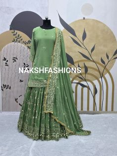 Lehenga Fabric :-*  Heavy Faux Georgette Material with 5mm Sequence Embroidery Work. *Lehenga Flair:* *3 meter* *Lehenga Inner :* Micro Cotton *Lehenga Length :* 40-41 Inch  *Top  Fabric:* Heavy Faux Georgette Material and 5mm Sequence Embroidery Work *Dupatta Fabric :* Heavy Georgette Material With 5mm Sequence Embroidery Work. (dupatta size 2.30 )  *Size* :- Top Length 36-37''  XL(42) *( Fully Stitched)* , *( Lehenga Semi Stitched )*  *Weight*    :  1kg  *#Free Size Semi Stitched Lehenga With Green Georgette Lehenga With Sheer Dupatta, Embroidered Green Georgette Choli, Semi-stitched Green Georgette Lehenga, Green Unstitched Georgette Choli, Green Semi-stitched Cutdana Choli, Indian Tops, Georgette Material, Cotton Lehenga, Georgette Tops