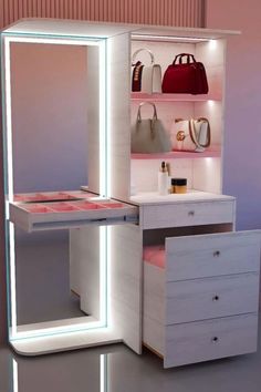 an illuminated makeup vanity with drawers and mirror