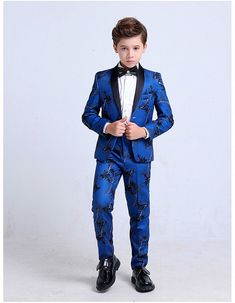 PRODUCT DESCRIPTION Meant for the Gala, this 4-piece South Florida inspired suit will turn heads. Your next social celebration, Le Petit Gentlemen in your life will be looking suave and sophisticated. Our stylish, sleek design Miami Midnight Tuxedo comes with the signature jacket and trousers, matching vest, and a brilliant white shirt to contrast this suit bejeweled black bowtie. All 4 pieces are tailored in modern styling, tapering at the waist and staying slim while also maintaining comfort t Fitted Semi-formal Set With Suit Collar, Formal Tuxedo Sets With Slim Fit, Business Tuxedo Set With Long Sleeves, Tailored Party Sets With Suit Collar, Tailored Long Sleeve Party Sets, Fitted Three-piece Suit With Suit Collar For Party, Elegant Party Sets With Suit Collar, Black Spring Wedding Suit, Black Semi-formal Sets For Spring