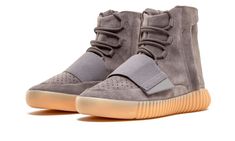 The third installment of the adidas Yeezy Boost 750 sees the inaugural sneaker from Kanye West's Yeezy line in a clean "Light Grey/Gum" colorway.  The upper is constructed with premium suede, complete with a velcro strap for lockdown support.  Other noteworthy design cues include the perforated vamp and a zipper on the side panel to provide easy slip-on access.  Finally, the gum sole glows in the dark.  Much like any product bearing West's name, details like those mentioned make the Yeezy Boost Adidas Yeezy 750 Boost, Grey Yeezy, Gum Shoes, Yeezy Boost 750, Yeezy 750, Adidas Models, Designer School Bags, Yeezy Boost, Adidas Tubular Defiant