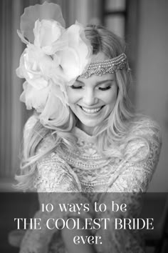 black and white photograph of a smiling woman with flowers in her hair wearing a head piece