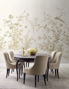 a dining room table with chairs around it