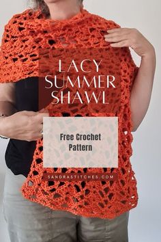 a woman holding up an orange crochet shawl with text that reads lacy summer shawl free crochet pattern