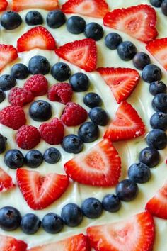 red, white and blue fruit pizza with yogurt on top is featured in this post