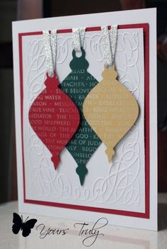 a card with two ornaments hanging from it