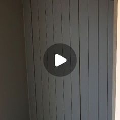 an image of a door with a play button on the front and side paneling