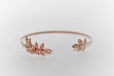 This beautiful choker is made out of an intricate and detailed selection or rose and rose leaves, all soldered securely on each side, on a flexible and adjustable base. Measurements: The circumference is approximately 12 inch / 30 cm * Comes wrapped in a beautiful gift bag/box.* Available in 14k gold, rose gold or silver plated brass. For updates, new products, one-of-a-kind's, special offers and more-like us on Facebook:https://www.facebook.com/avigailadamjewellery Follow me on Instagram: https Elegant Adjustable Rose Gold Choker, Adjustable Rose Gold Metal Choker, Beautiful Chokers, Adjustable Base, Rose Leaves, Gift Bag, Or Rose, Gold Rings, Gold Bracelet