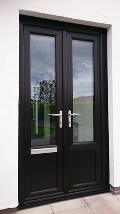 a black double door with glass on the outside