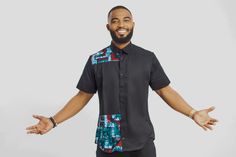 Our Ankara shirt combines the classic charm of a button-down with a versatile blend of smart and casual elements, making it the perfect choice for those in-between days. Whether you pair it with jeans for a relaxed look or opt for smart trousers, this shirt effortlessly adapts to various occasions. To elevate its style for business settings, simply add a contrasting jacket, and you'll exude a sophisticated and polished appearance. Size and fits: Model is wearing a size L  Please refer to the siz Ankara Shirts For Men, Ankara Shirt, Modern African Clothing, African Print Shirt, Study Hacks, African Shirts For Men, African Print Clothing, Black Sky, African Clothing For Men