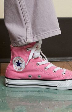 Online only! Rock classic Converse style with the timeless Kids Pink Chuck Taylor All Star High Top Shoes. Your fave sneakers now come in a super cute pink wash and have the same lace-up front and Converse branding.


	Canvas construction
	Lace-up front closure
	High top silhouette
	Converse branding