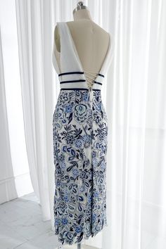 This Blue and White Embroidery Floral Sheath Deep V Neck Midi Dress will turn heads! Crafted with midweight cotton fabric, it features a figure-flattering deep v neckline and a classic sheath silhouette with beautiful floral embroidery. The subtle midi length ensures you'll look sophisticated and stylish. Bust and Skirt with full lining. 100% Polyester 100% Recycled polyester lining Concealed zip at centre back Imported Blue Cotton Maxi Dress With Floral Embroidery, Fitted Blue Maxi Dress With Floral Embroidery, Fitted Blue Embroidered Maxi Dress, Fitted Embroidered Blue Maxi Dress, Blue Fitted Maxi Dress With Embroidery, Look Sophisticated, Floral Pattern Dress, Embroidery Floral, Fabric Accessories