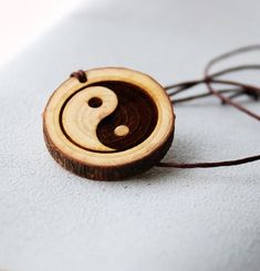 Oriental Yin Yang, Yin yang pendant necklace, Pendant Necklaces, Symbol Necklaces, Yin Yang, Zen, yoga, Meditation Gift, spiritual jewelry This wood pendant is cut from raw tree, it has delightful and nice smell. You can feel it as you are in the forest. This Ying yang engraved symbol wood pendant necklace is  designed by me Katie. The leather necklace is adjustable. it is handmade item. That is the new idea to bring this to the interested people. Hope i can help you get it into what you want and what you thought about. Zen Yoga, Symbol Necklace, Meditation Gifts, Ying Yang, Wood Pendant, Spiritual Jewelry, Leather Necklace, Yoga Meditation, Yin Yang