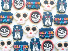 decorated sugar cookies are arranged in the shape of skulls and skeletons with names on them