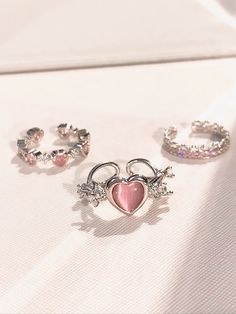 𝔇𝔢𝔱𝔞𝔦𝔩𝔰 Style: Y2k, Coquette, Kawaii Materials: Rhinestone Quantity: 3 pcs(set) This exquisite set features adorable heart-shaped stones that are bound to steal your heart! The rings are shinning and give off a delightful glimmer, adding a touch of sparkle to any outfit. Enjoy free shipping with a purchase of over 80$ Trio Rings, Kawaii Ring, Rhinestone Rings, Coquette Kawaii, Ring Party Jewelry, Trio Ring, Heart Rhinestone, Heart Accessories, Korean Jewelry