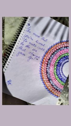 an open spiral notebook with writing on it