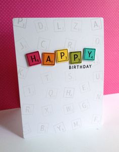 a happy birthday card with blocks spelling out the word happy on it's front