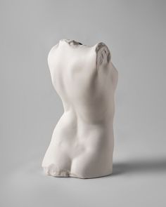 a white sculpture sitting on top of a table