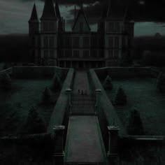 an image of a creepy castle with stairs leading up to the front door and dark clouds in the sky