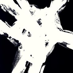 an artistic black and white photo of a cross