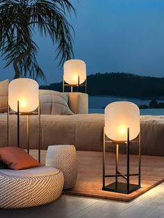 Illuminate your outdoor space with the elegant and comfortable Modern Lantern Outdoor Floor Lamp. Made of stainless steel and glass, it is easy to install and automatically charges in direct sunlight for warm lighting at night. Waterproof and perfect for gardens and patios. Enjoy reading, entertaining, or a late-night stroll in style! Details Materials: Stainless Steel, Glass Light source: Integrated LED Kelvin range: Warm Light (3000K), Neutral Light (4500K), Cool Light (6000K) Power: ~15W Voltage: AC 110-240V/Solar power storage Mounting: Floor Environment: Outdoor Factory shipment: 5-10 days to prepare on average IP: IP65 Body Finishes: Black Process: Baking paint, Cutting Control method: Compatible with common wall switches (not included) Product Size Size: Dia 30cm x H 48cm / ∅ 11.8″ Floor Lamps Outdoor, Solar Lights For Patio, Outdoor Standing Lamp, Outdoor Lamps Patio, Cute Porch Ideas, Balcony Lanterns, Outdoor Floor Lighting, Around The Pool Ideas, Outdoor Table Lighting