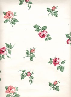 a white sheet with pink roses on it and green leaves in the middle is shown