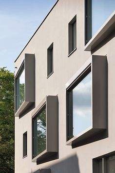 several windows on the side of a building