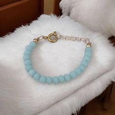 Key Features: ~14K gold-plated beads ~Matte baby blue crystal beads ~ 14K gold-filled clasp with 1/2" extension loops (easy to adjust, allowing the bracelet to grow with your baby).  THERE ARE NO RETURNS OR EXCHANGES FOR WRONG SIZE OR DAMAGE TO BRACELET AFTER DELIVERY.  To ensure proper sizing, please measure your baby's wrist before you purchase. Use a soft measuring tape tightly and add 1/2" to find the correct size. Every bracelet includes a ½" of extension loops for growth and wiggle room as well.  WARNING: CHOKING HAZARD Never leave a child unattended with a bracelet on. Toddler Jewelry, Gift For Newborn, Jewelry For Girls, Girl Bracelet, Girl Toddler, Measuring Tape, Girls Birthday, Newborn Girl