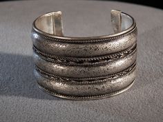 I am offering you this wonderful vintage and very unique and ornate silver plated bangle extra wide cuff style bracelet with amazing detailed designs and very domed. Just look at the fabulous detail in this very bold, wide, domed raised relief , etching, and braid work adorning the entire circumference of this marvelous cuff bangle bracelet. This is a very unique design, having so many ornate elements to it, with of very thick and heavy cuff / bangle style bracelet What a fabulous combination of Kissy Lips, Cuff Bangle Bracelet, Bangles Style, Ear Piercing, Wide Cuff, Hinged Bangle, Favorite Rings, Cuff Bangles, Fashion Accessories Jewelry