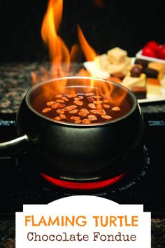 a pot filled with food sitting on top of a stove next to a plate of food