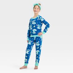 Bring the magic of a classic Disney hit to your kid's' wardrobe with this Lilo & Stitch 2-Piece Pajama Set and Headband in blue. This pack includes a headband, a long-sleeve sleep shirt with Lilo & Stitch prints designed with a crew neckline, and a pair of pajama pants with allover Lilo & Stitch prints for a fun, playful look. Tailored in a regular fit, this pajama set is great for movie nights and bedtime stories. Cozy Pajamas, Kids Wardrobe, Fleece Pajamas, Pajama Pant, Lilo Stitch, Stitch 2, Movie Nights, Print Pajamas, Sleep Shirt