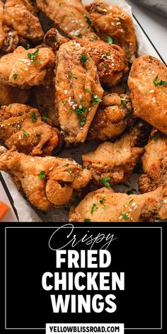 fried chicken wings on a plate with carrots in the background and text overlay that reads easy fried chicken wings