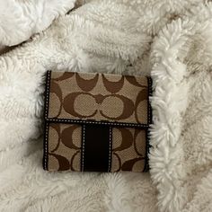 Coach Sig. Mini Wallet Khaki/Mahogany Coach Rectangular Brown Coin Purse, Brown Rectangular Coach Coin Purse, Classic Coach Coin Purse For Everyday Use, Brown Wallets With Interior Card Slots For Daily Use, Brown Travel Wallet With Coin Pocket, Chic Brown Wallet For Everyday Use, Chic Brown Wallets For Everyday Use, Coach Rectangular Wallet With Coin Pocket, Luxury Brown Coin Purse With Coin Pocket