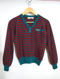 Cool Vintage 70s 80s Red & Teal Stripe Textured Knit Long Sleeve Top Please note that colors can vary from screen to screen, and in real life.  Has a mini pocket on chest. Fabric is kind of bouclé style velour... it's unique! Cozy! Has stretch. Best fits a SMALL Shoulder 18.5 inches (laid flat) Bust 16.5-20.5 inches (laid flat) Length, Top to Bottom 21.5 inches Bottom Opening 11.5-14.5 inches (laid flat) Sleeve Length 21 inches  Sleeve Opening 2-4.5 inches (laid flat)  Tag: Gloria Vanderbilt Condition: 2 Condition Scale:  1-Immaculate Vintage Condition (Rare) 2-Unnoticeable Vintage Wear or Spots that are unphotographable 3-Small Noticeable Vintage Wear or Spots, as photographed 4-A Lot of Noticeable Vintage Wear or Spots, as photographed 5-Needs Repair or Work Stripes Texture, Red And Teal, Gloria Vanderbilt, Knit Long Sleeve, Pullover Sweater Women, Long Sleeve Knit Tops, Cool Vintage, Textured Knit, Vintage Wear