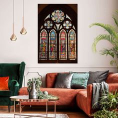 a living room filled with furniture and a large stained glass window