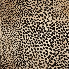 an animal print pattern is shown in black and beige colors, with spots on the fur