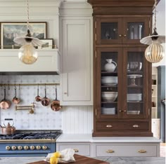 a kitchen with an oven, counter top and cabinets in the middle of it's center island