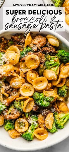 a white bowl filled with pasta and broccoli