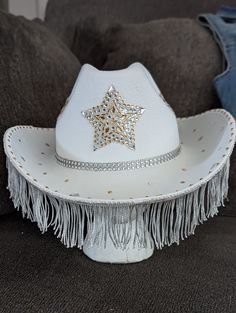 A cowboy hat with star designs throughout, gold and silver rhinestones for that extra razzle dazzle and silver fringe to set it over the top 🤠 For a custom designed hat please message the shop and we'd love to work with you! 😉 Bedazzled Cowboy Hat, Fringe Cowboy Hat, Cowgirl Hats Western, Custom Cowboy Hats, Western Dance, Cowboy Costume, Cowgirl Bachelorette, Cowboy Wedding, Cowboy Girl