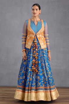 Persian blue anarkali with all-over digital Bhagalpuri print, gota patti trims on the bodice and sheer full length sleeves. Comes with floral embroidered orange short jacket.
Components:2
Pattern:Embroidery and Print
Type of Work:Digital Bhagalpuri Print, Hand Adda Work and Gota
Neckline:Notch
Sleeve Type:Anarkali: Long and Jacket Sleeveless
Fabric:Slub Silk
Color:Blue,Orange
Other Details:
Jacket with tie up front
Sheer sleeves with lace trims on the elbows
Cutout back jacket
Closure: Anarkali: Anarkali With Jacket, Anarkali Jacket, Embroidered Orange, Blue Anarkali, Printed Anarkali, Persian Blue, Indian Textiles, Lace Trims, Jacket For Women