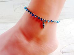 I created this pretty anklet using three shades of silver lined, AB coated blue glass seed beads, tightly crocheting all onto sand colored nylon cord, and finishing with a silver tone spiral seashell charm. Perfect for a fun day in the sun--whether you're at the beach or not! Prefer a different charm? I have lots to choose from - please make your choice from the drop down menu. This dainty yet sturdy anklet comes in three sizes--all with an attached 1-inch silver plated extender chain which can Handmade Blue Anklets For Beach Season, Blue Strand Anklets For Festivals, Blue Beaded Bracelets With Silver Beads For Beach, Blue Tiny Beads Jewelry For Beach Season, Silver Anklets With Tiny Beads For Beach, Seashell Anklet, Spiral Seashell, Summer Jewelry Beach, Dragonfly Bracelet