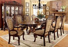 a dining room table with chairs and a chandelier