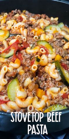 a skillet filled with pasta and vegetables