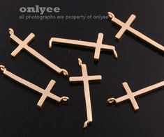 four crosses are shown on a black surface with the words onlyee written in white