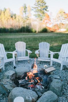 a fire pit with chairs around it