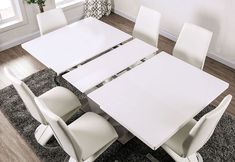 a white table and chairs in a room