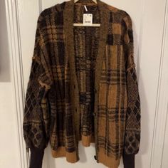 Free People Cardigan Sweater. Size Is Medium, But It's A Very Oversized Fit. Fabric Is Super Warm And Soft. Would Be Cute With A Tank Top Underneath And Have The Sweater Be Worn Hanging Off Your Shoulder. Plaid V-neck Cardigan For Fall, Oversized Plaid Casual Cardigan, Oversized Casual Plaid Cardigan, Casual Oversized Plaid Cardigan, Oversized Plaid Long Sleeve Cardigan, Oversized Plaid Sweater For Fall, Casual Plaid Cardigan For Layering, Oversized Plaid Winter Cardigan, Oversized Plaid Cardigan For Winter