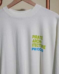 Pirate Arch-Itecture T-Shirt Color: Off White Weight: 6.5oz 100% Cotton Front Left Chest Graphic Back Center Graphic Model is 6'1" wearing a size L White Oversized Crew Neck T-shirt, White Graphic Print Crew Neck Tops, Shirt Color, Colorful Shirts, Arch, Graphic Tees, Off White, T Shirt, White