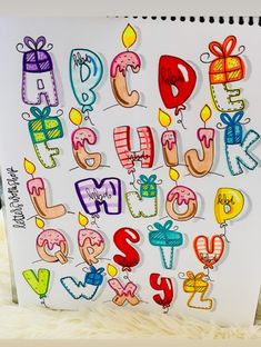 a drawing of the letters and numbers that are drawn with colored pencils on paper